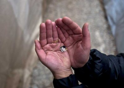 Rustum Abdulrahman, 35, a Syrian refugee from the northern district of Al-Ashrafiya, Aleppo, shows a photograph of his wife Zuzan, 33, at Ritsona refugee camp, Greece. "I keep this image always with me, I made it as small as possible so no matter what it won't be damaged and will never loose it, my wife is my best friend and the partner of my life." Rustum said.