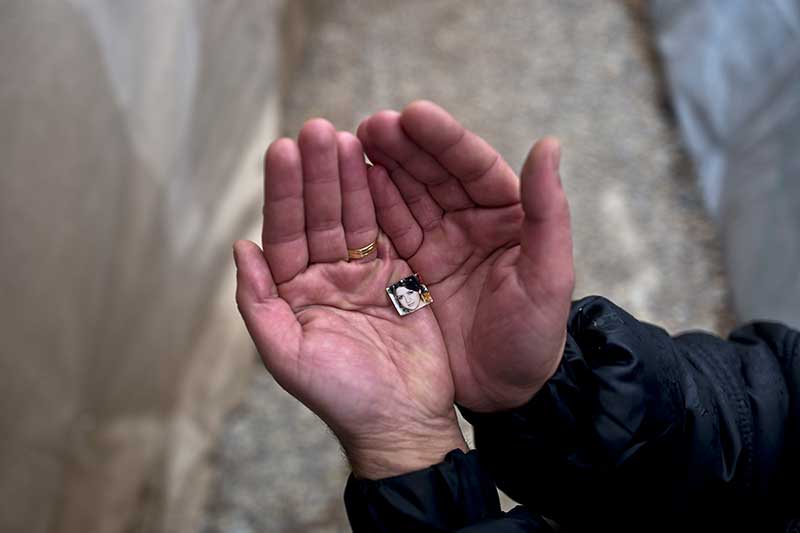 Rustum Abdulrahman, 35, a Syrian refugee from the northern district of Al-Ashrafiya, Aleppo, shows a photograph of his wife Zuzan, 33, at Ritsona refugee camp, Greece. "I keep this image always with me, I made it as small as possible so no matter what it won't be damaged and will never loose it, my wife is my best friend and the partner of my life." Rustum said.