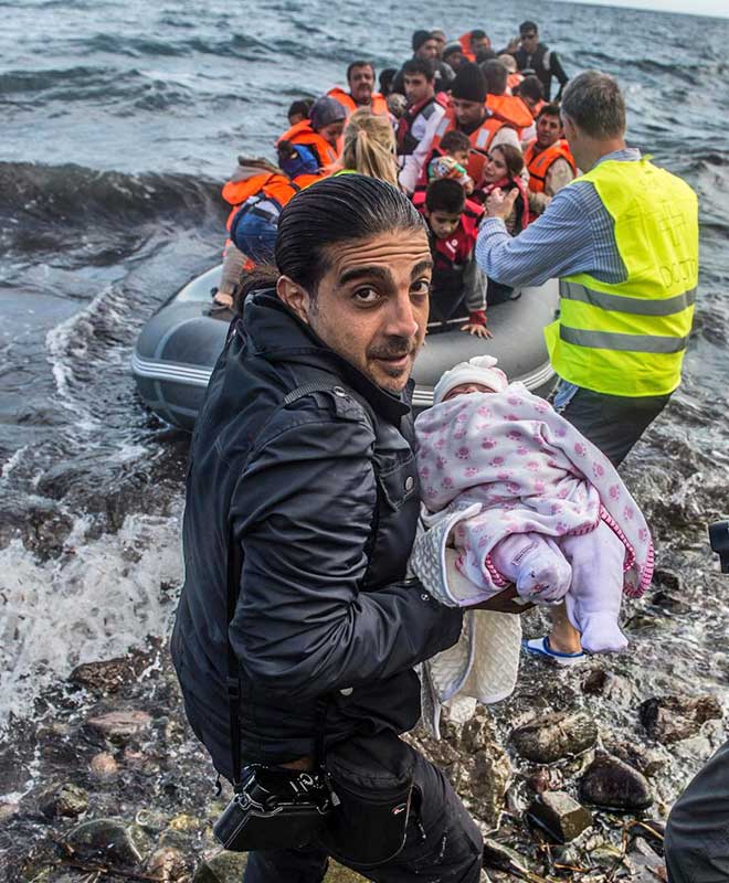 in the northeastern Greek island of Lesbos, Photo by Filip Singer. Muhammed Muheisen in the northeastern Greek island of Lesbos,